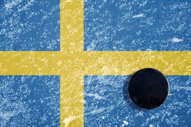 Swedish flag with a hockey puck. Photo: iStock