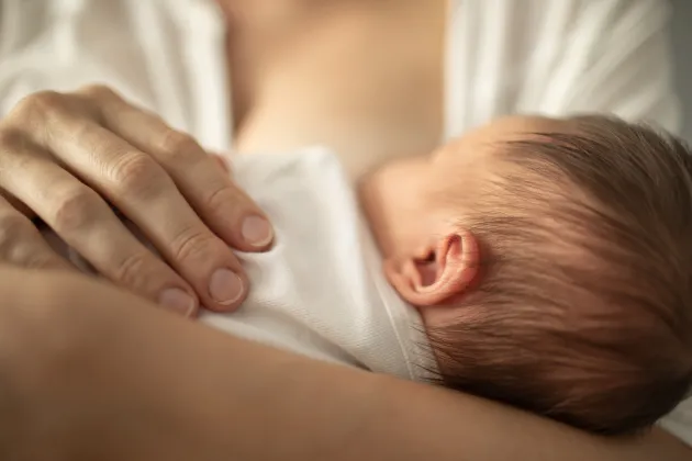 A woman breastfeeding a child. Photo: iStock